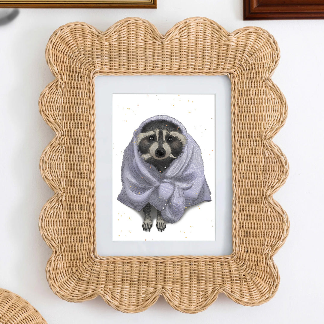 Postcard art of a cute raccoon wrap in a white hotel towel with a lot of details, framed on a wall.