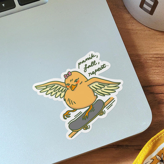 Vinyl sticker on laptop of a Yellow skater chick with a pink bow, skating skillfully on a rail.