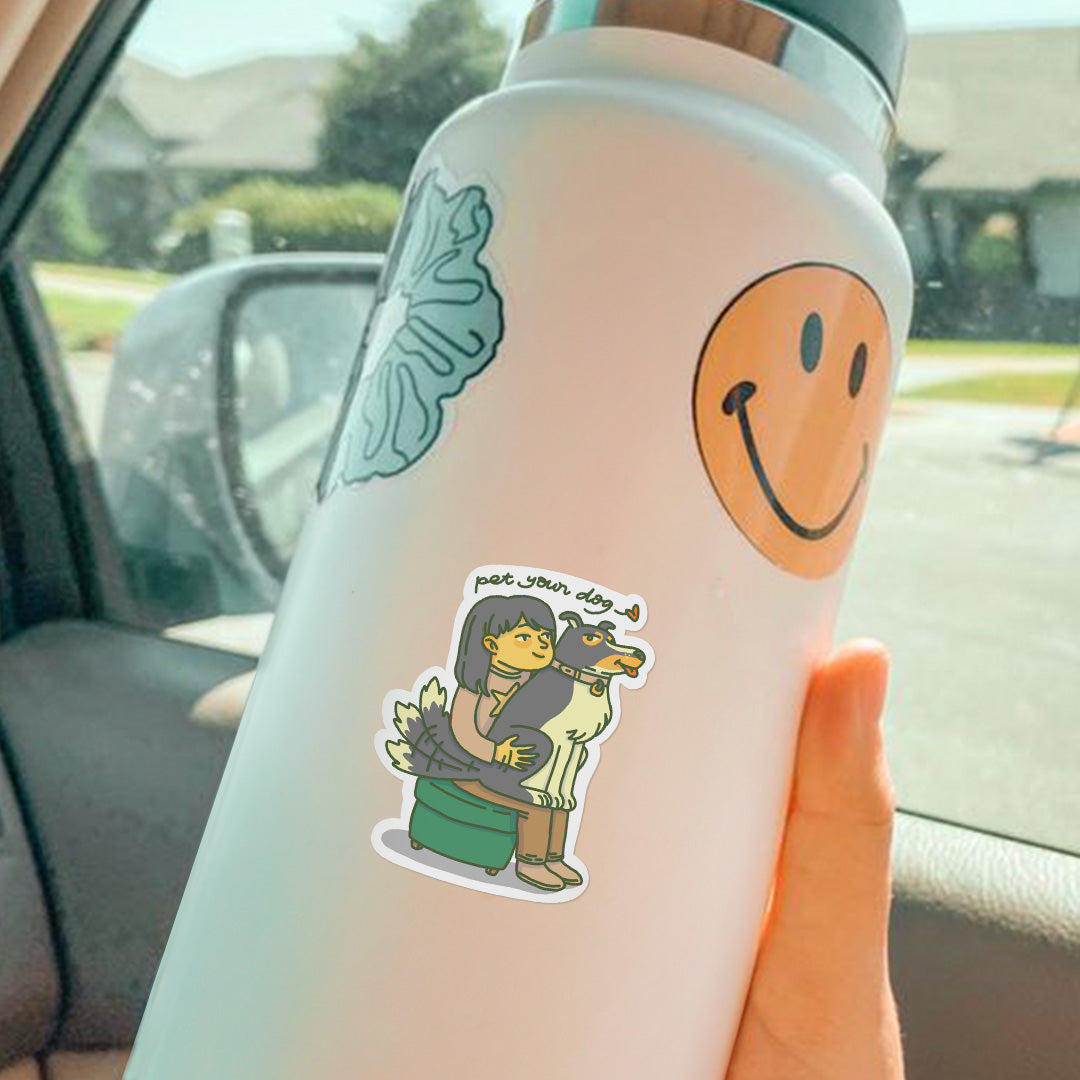 Vinyl sticker on water bottle of a cute Border collie dog sitting on the lab of a girl and she is petting his butt, the dog is wagging his tail, has side eyes and tongue out, the girl is saying pet your dog.